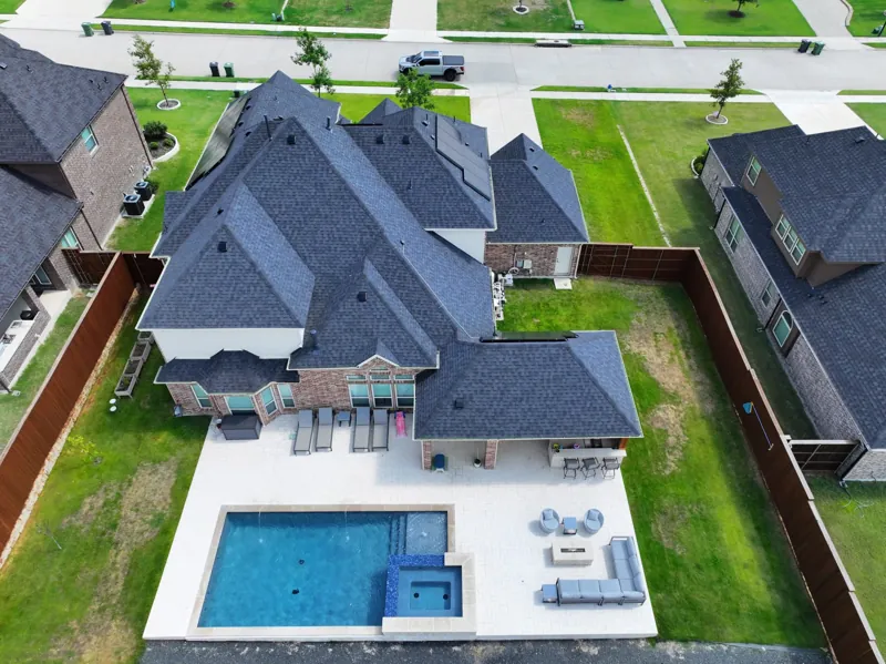 completed roof on a spacious DFW home with pool