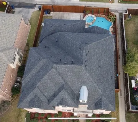 completed dark shingle roof on a DFW home