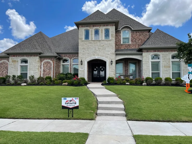 finished roof on a stone and brick DFW home